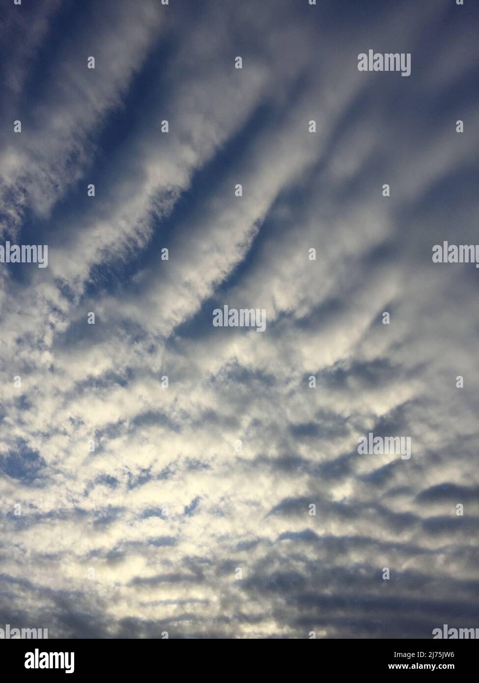 Cloud patterns at sunset Stock Photo Alamy