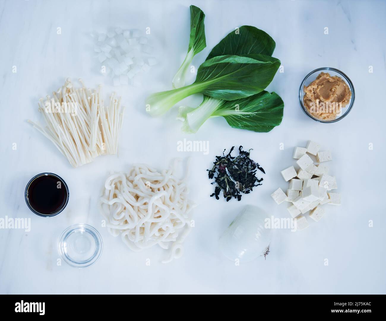 Asian noodle soup ingredients with mushrooms, bok choy, noodles, and onion Stock Photo Alamy