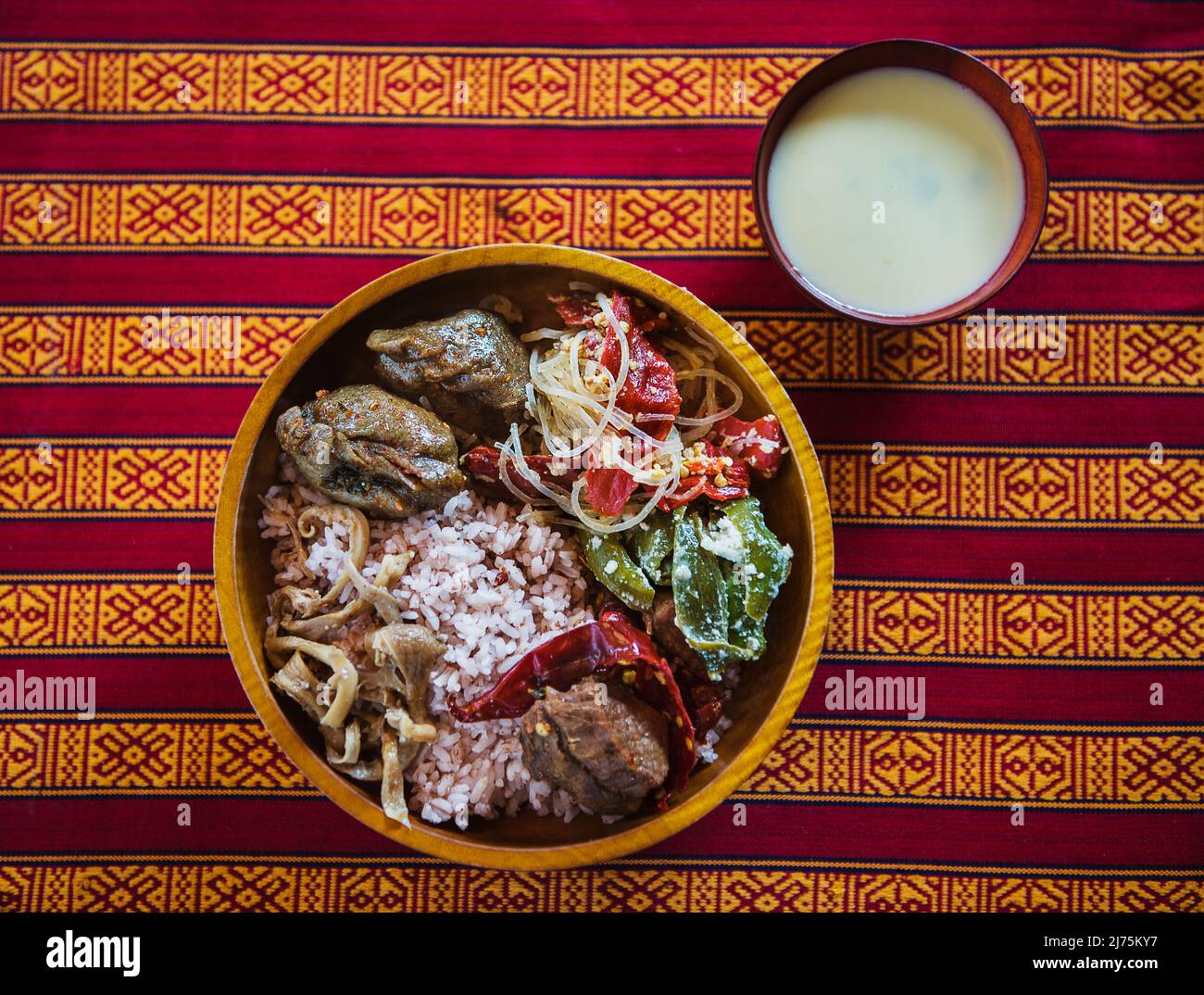 Bhutanese Red rice, beef, buckwheat dumplings and Ema Datshi Stock Photo