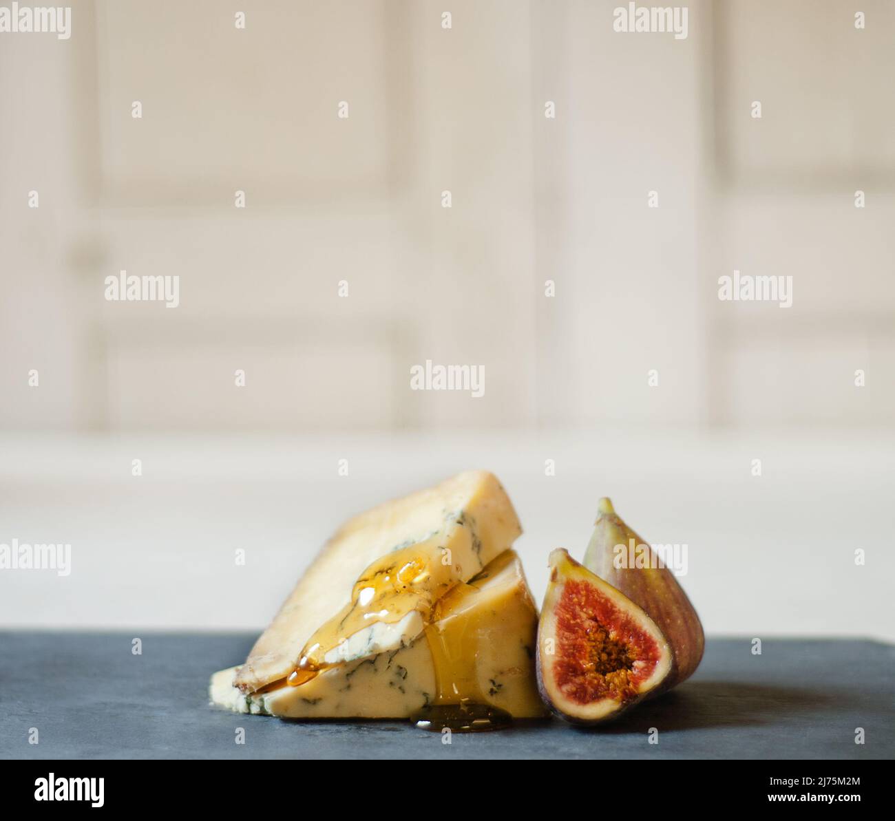 Blue cheese with honey and figs Stock Photo Alamy