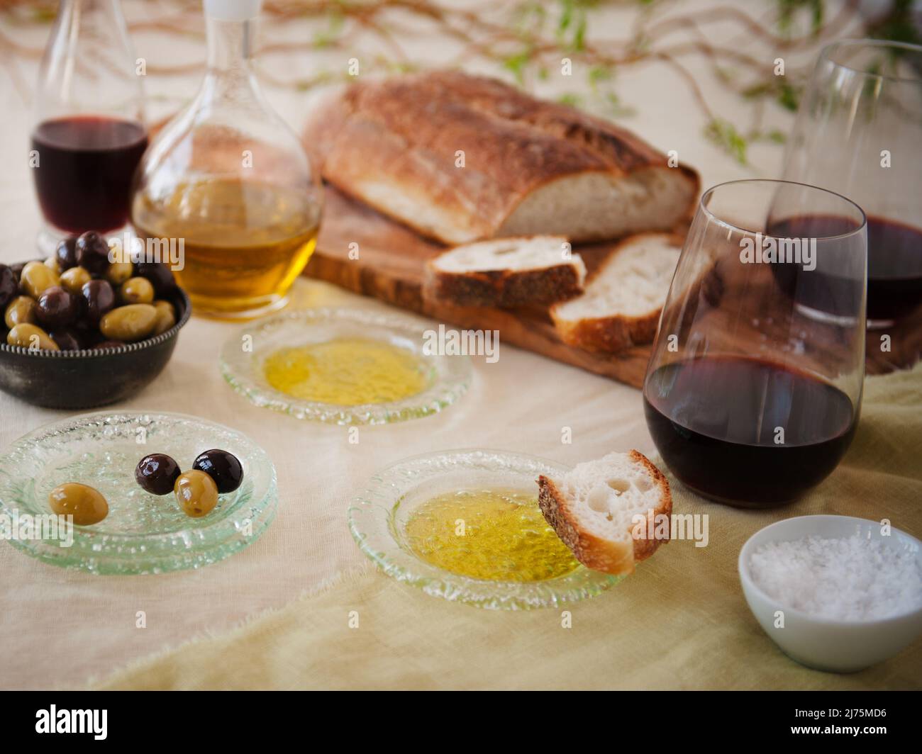 Bread and Dipping Oil; Olives, Red Wine, Oil and Vinegar Stock Photo