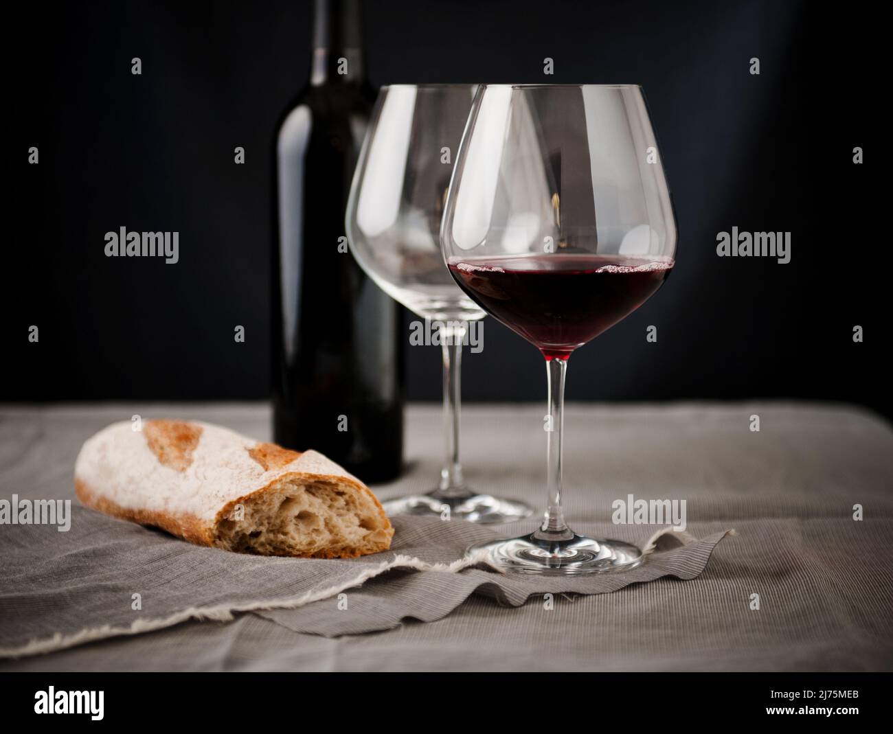 A Glass of Burgundy Wine with a Piece of Bread; Empty Wine Glass; Wine Bottle Stock Photo Alamy