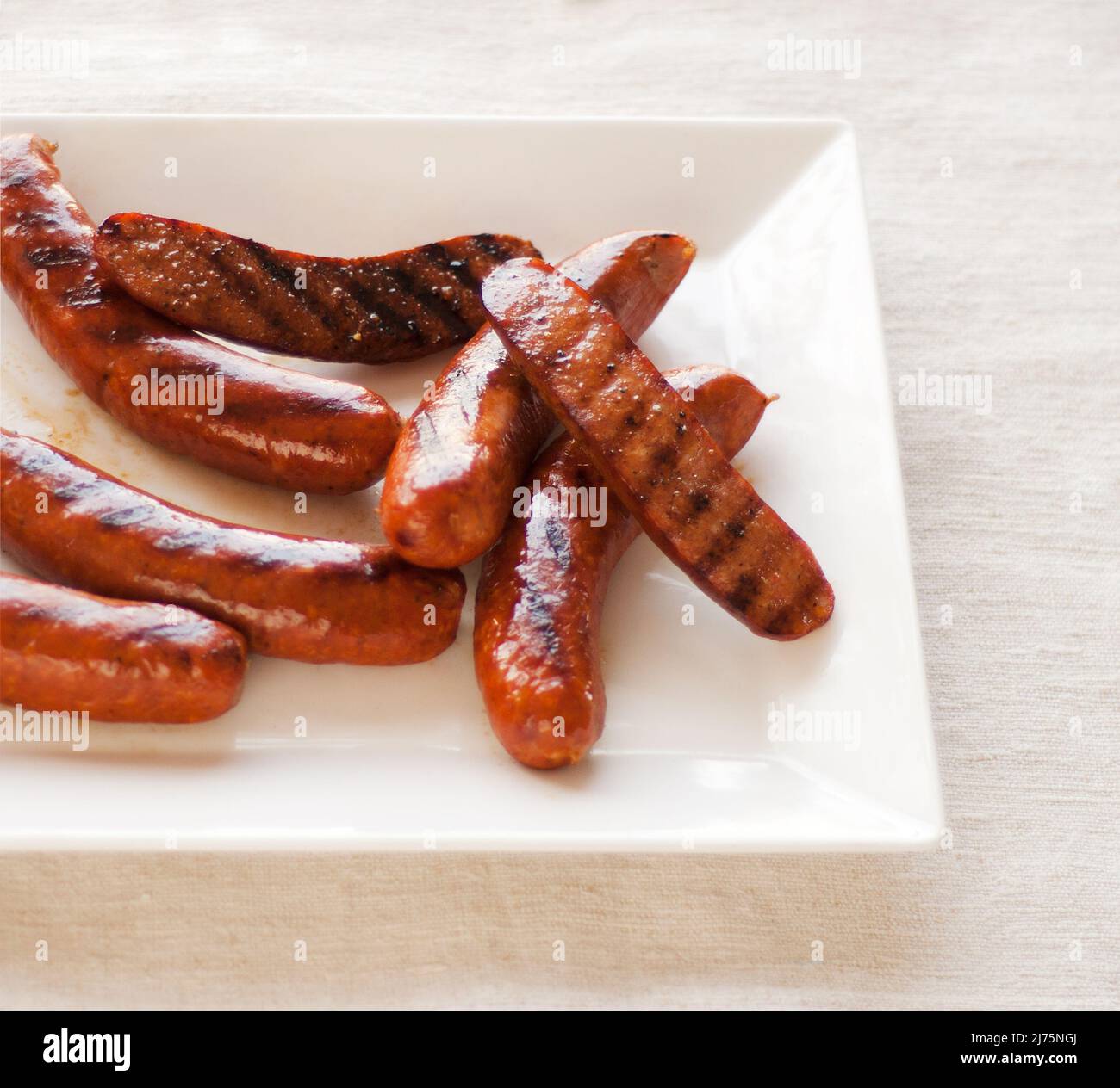 Platter of Grilled Smoked Sausage Halves Stock Photo Alamy