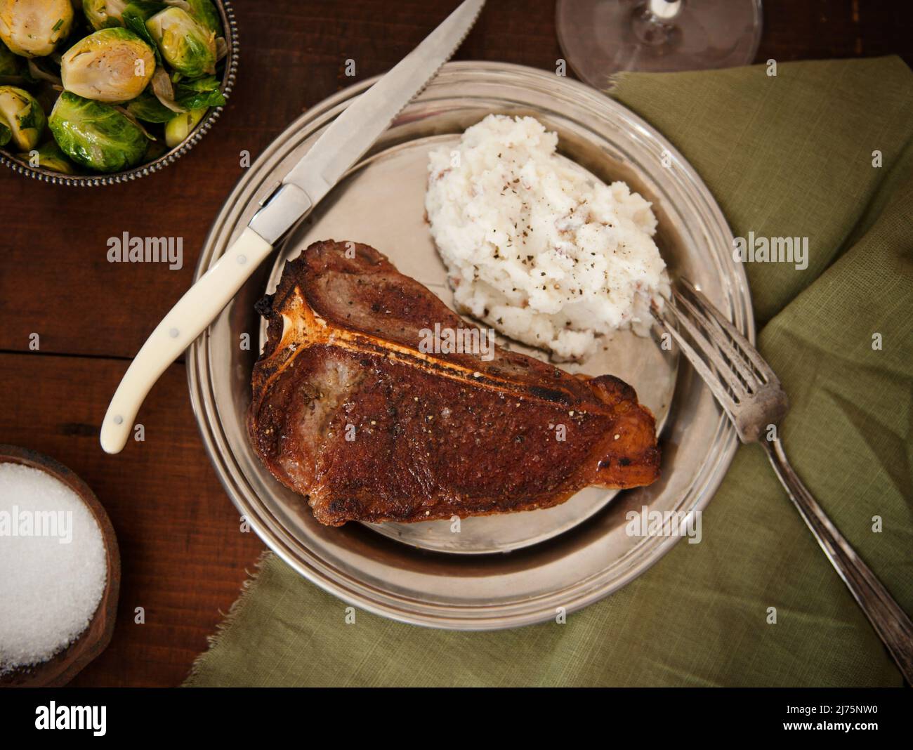 Whole Steak with Mashed Potatoes with a Side of Brussels Sprouts Stock Photo