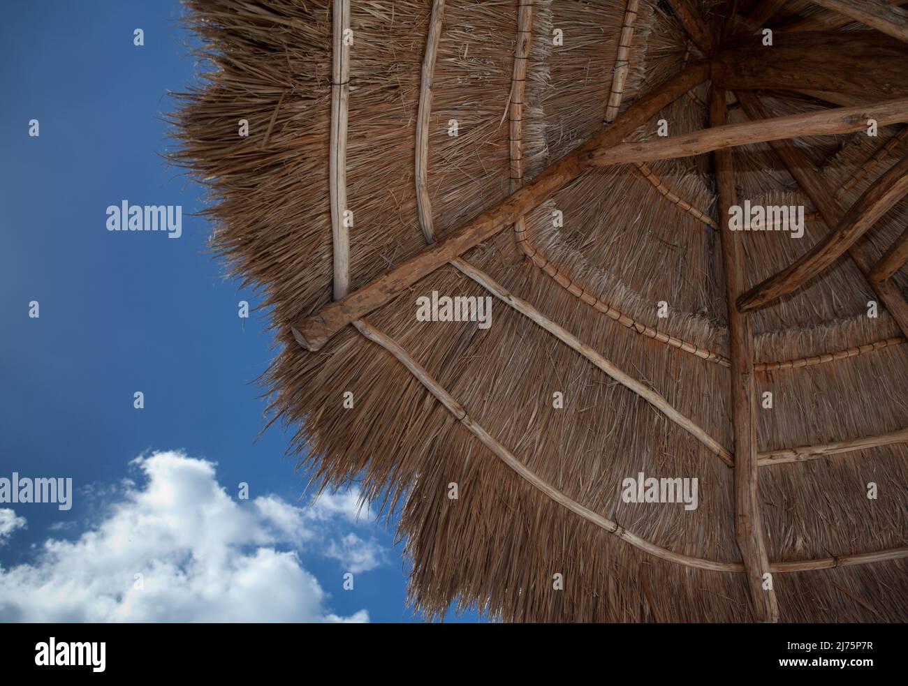 Location shot of a thatched umbrella Stock Photo