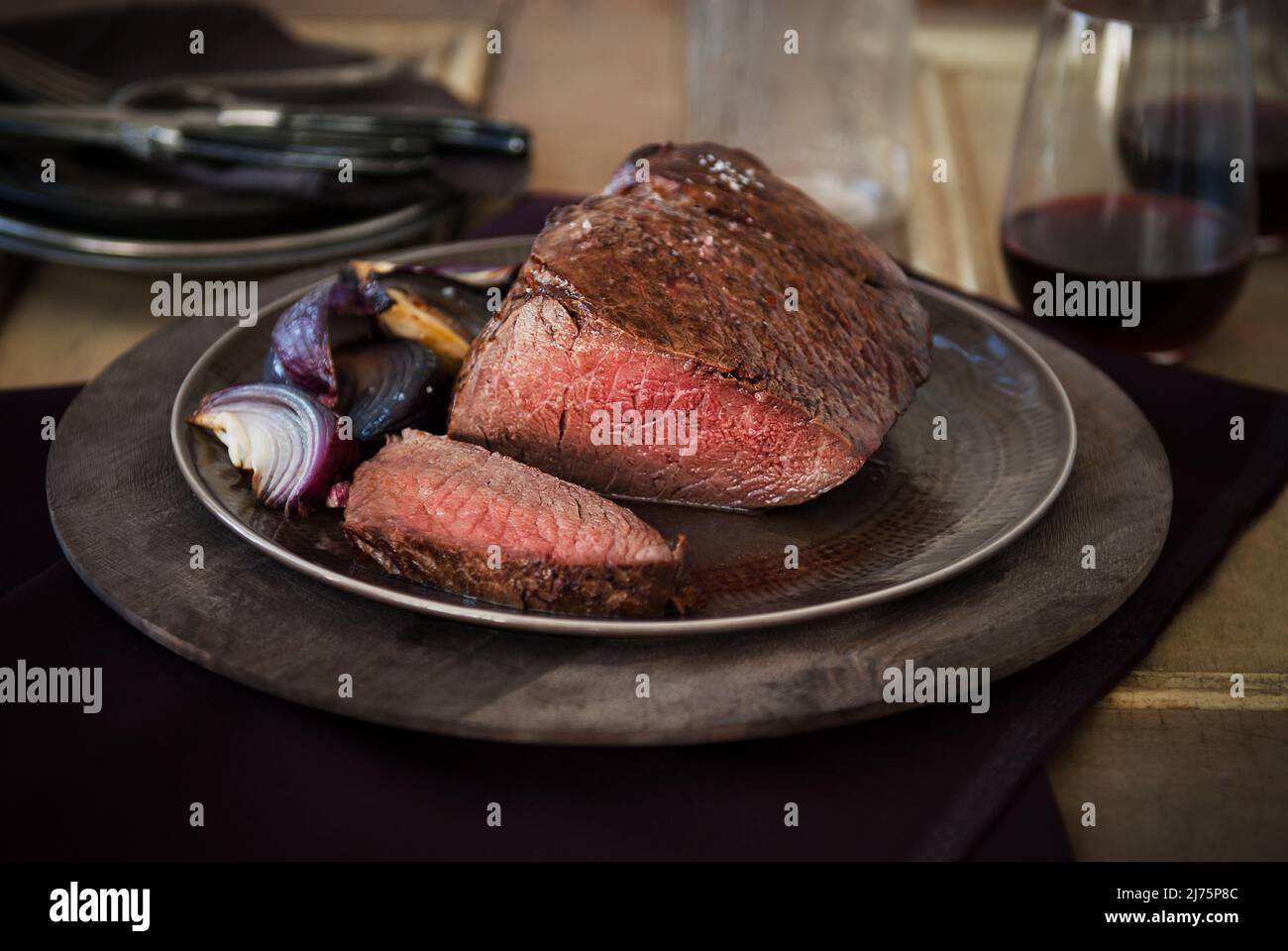 Grass Fed London Broil Roast; Sliced with Red Onions Stock Photo