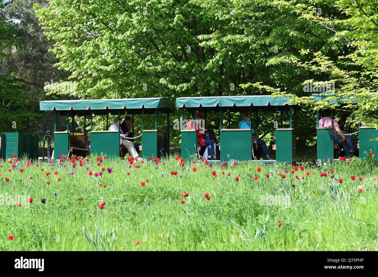 Berlin, Germany. 6th May, 2022. People take a mini train at Britzer