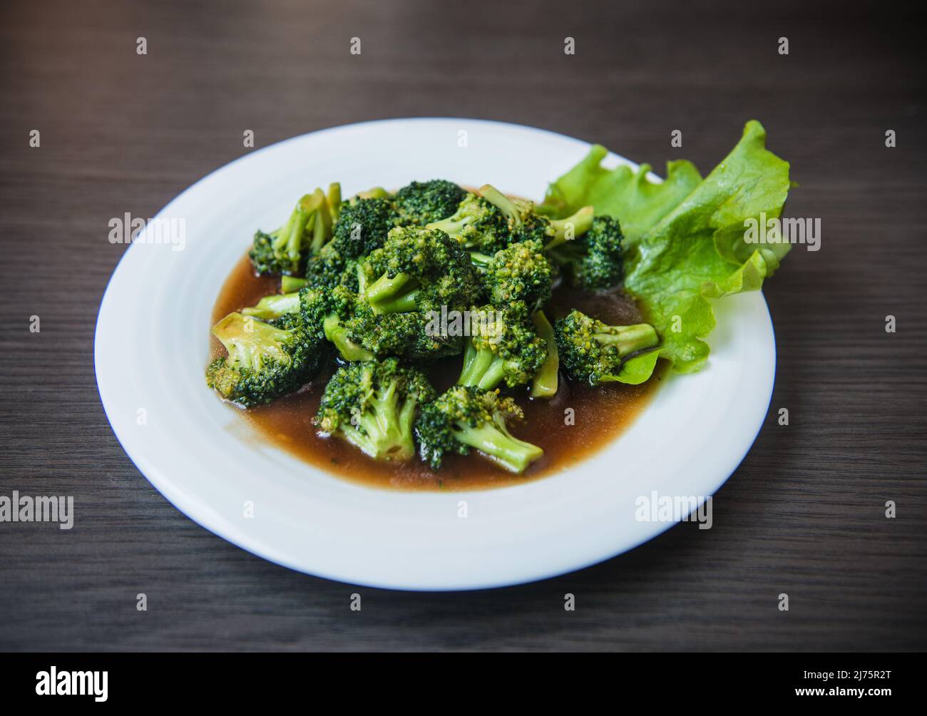 Broccoli with garlic sauce Stock Photo Alamy