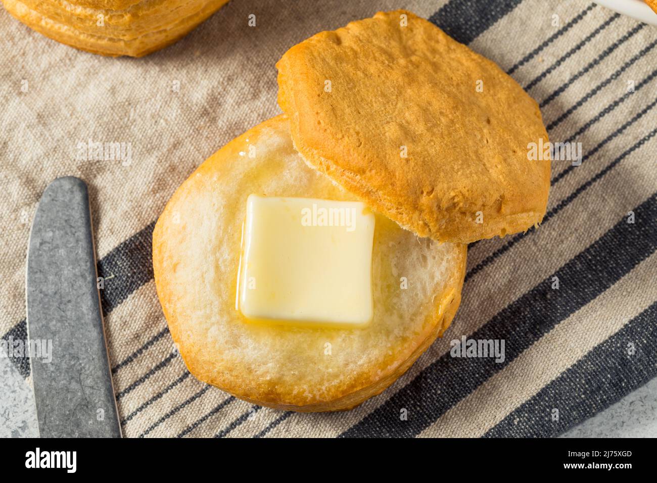 Homemade Southern Buttermilk Biscuits with Butter and Honey Stock Photo