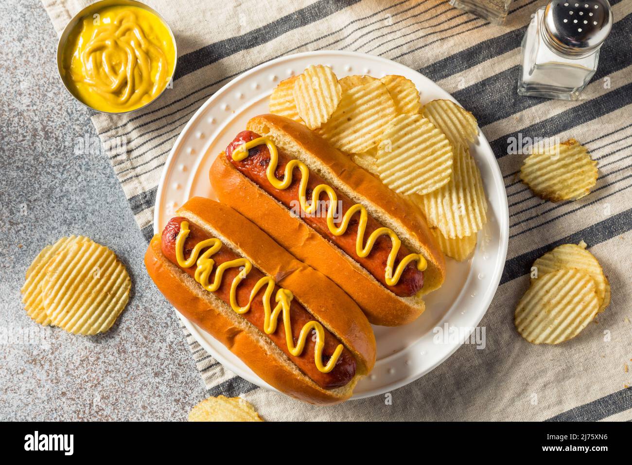 Homemade American Hot Dog with Mustard and Potato Chips Stock Photo Alamy
