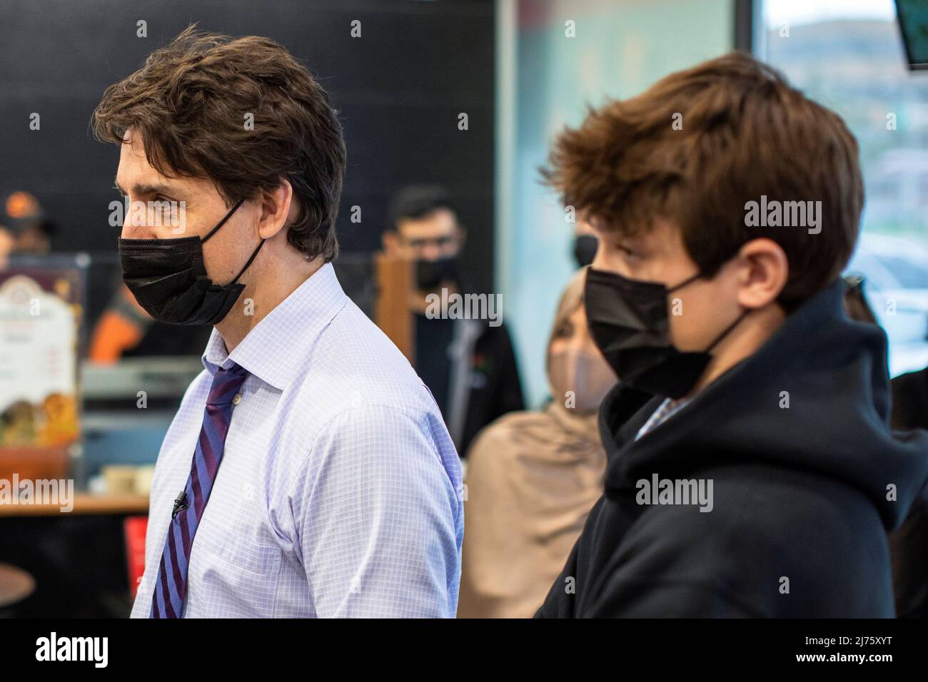 Canada's Prime Minister Justin Trudeau and his son Xavier James Trudeau visit newly resettled families from Afghanistan, at Eastern Food Market in Hamilton, Ontario, Canada May 6, 2022.  REUTERS/Carlos Osorio Stock Photo
