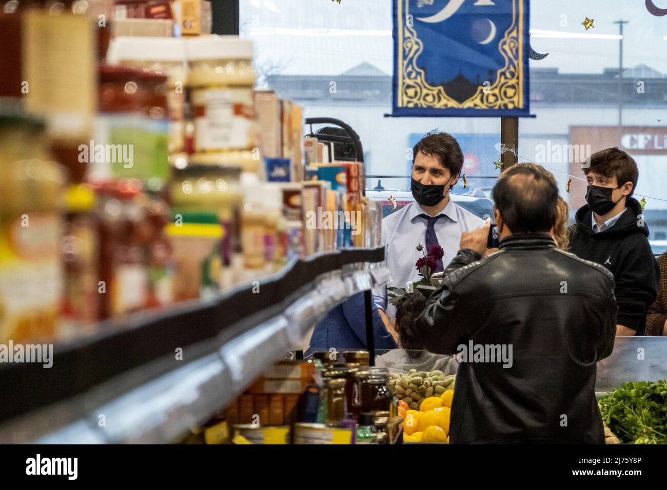 Canada's Prime Minister Justin Trudeau and his son Xavier James Trudeau visit newly resettled families from Afghanistan, at Eastern Food Market in Hamilton, Ontario, Canada May 6, 2022. REUTERS/Carlos Osorio Stock Photo