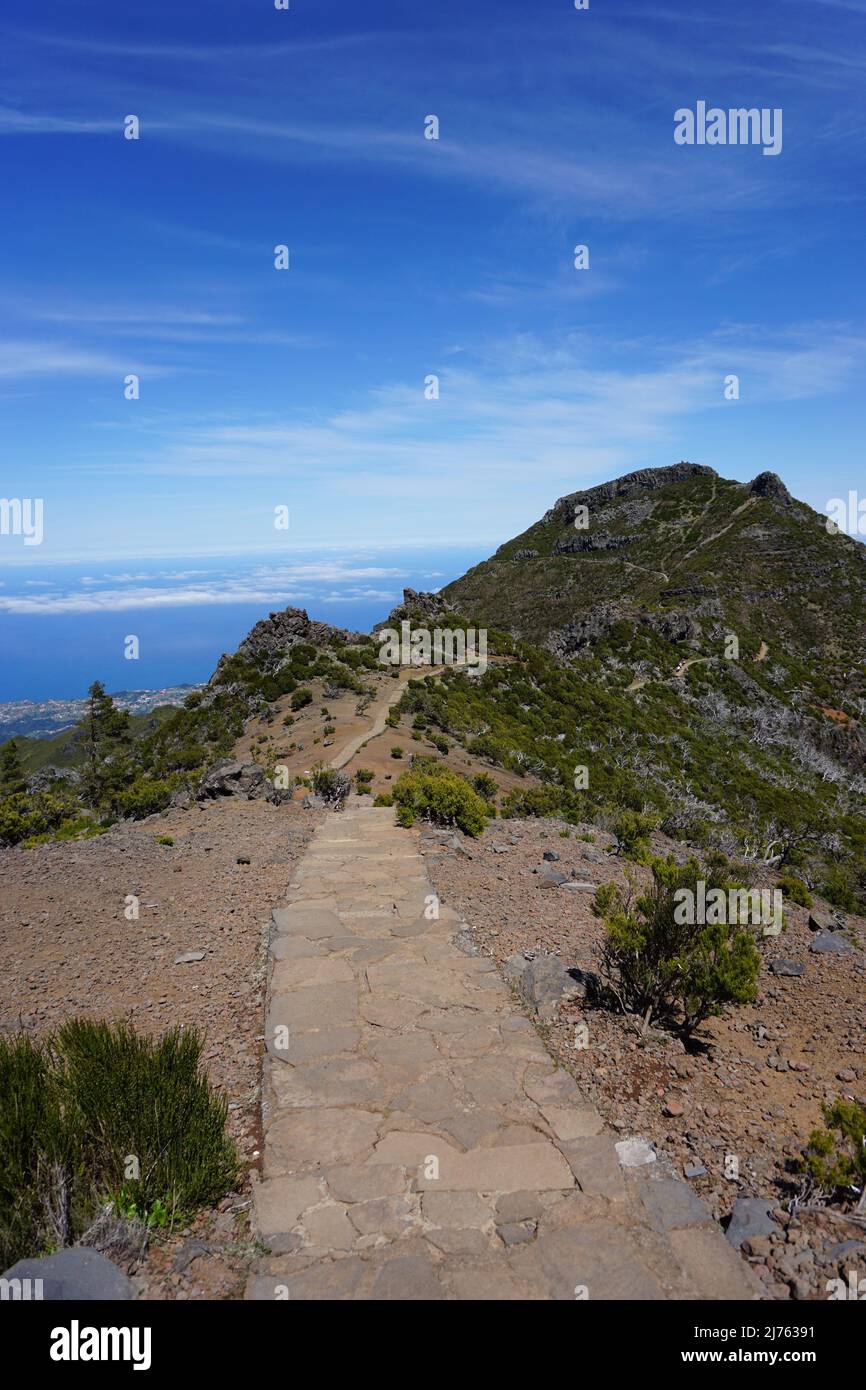 Rural hiking trail from Pico Ruivo to Pico Arieiro through the volcanic mountain range on the island of Madeira, Portugal, Europe. Photo by Matheisl Stock Photo