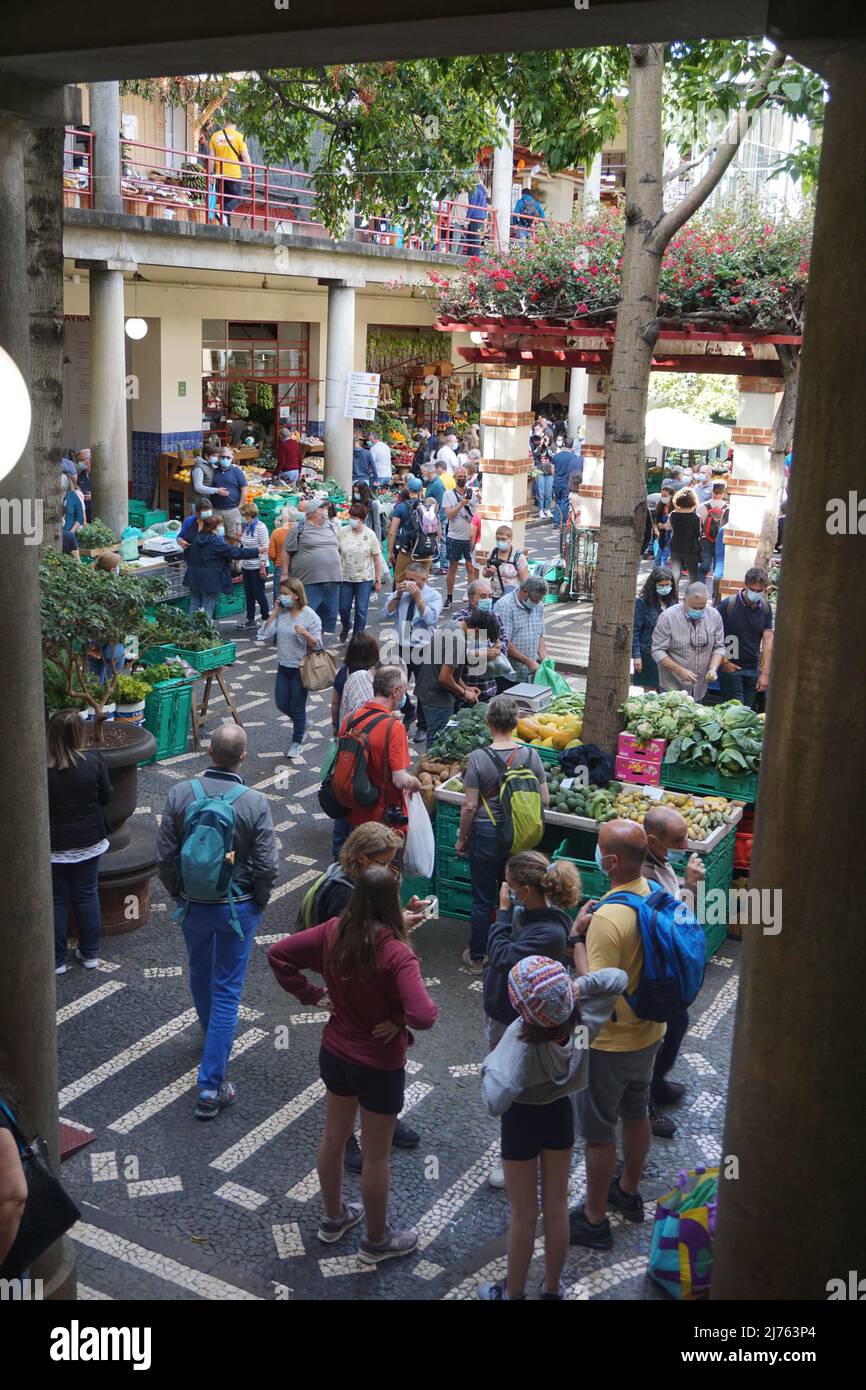 Tourists visiting the Mercado dos lavradores, fresh fruit and vegetables in the Funchal market, Madeira island, Portugal, Europe. Photo by Matheisl Stock Photo