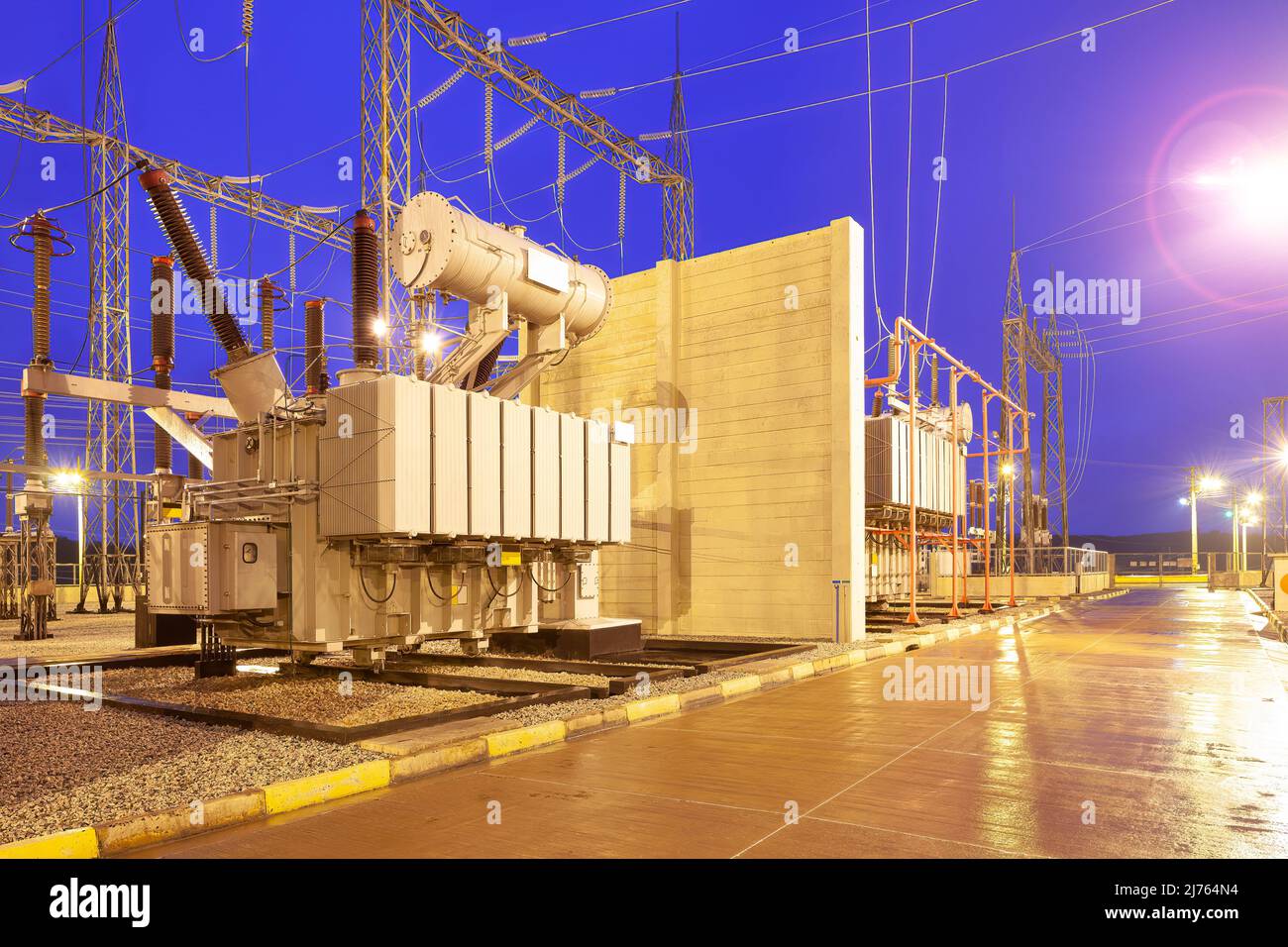 A group of Power Transformer in High Voltage Electrical Outdoor Substation Stock Photo