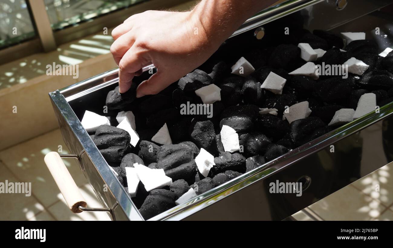 Charcoal and firelighters ready for Barbecue Fire in Mangal (middle