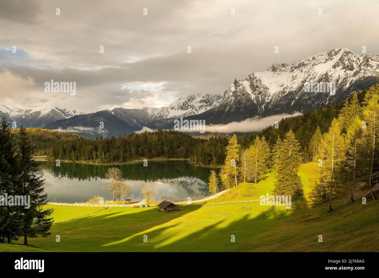 Evening mood at the Lautersee, with Stadl and in the background the snow covered Karwendel Stock Photo