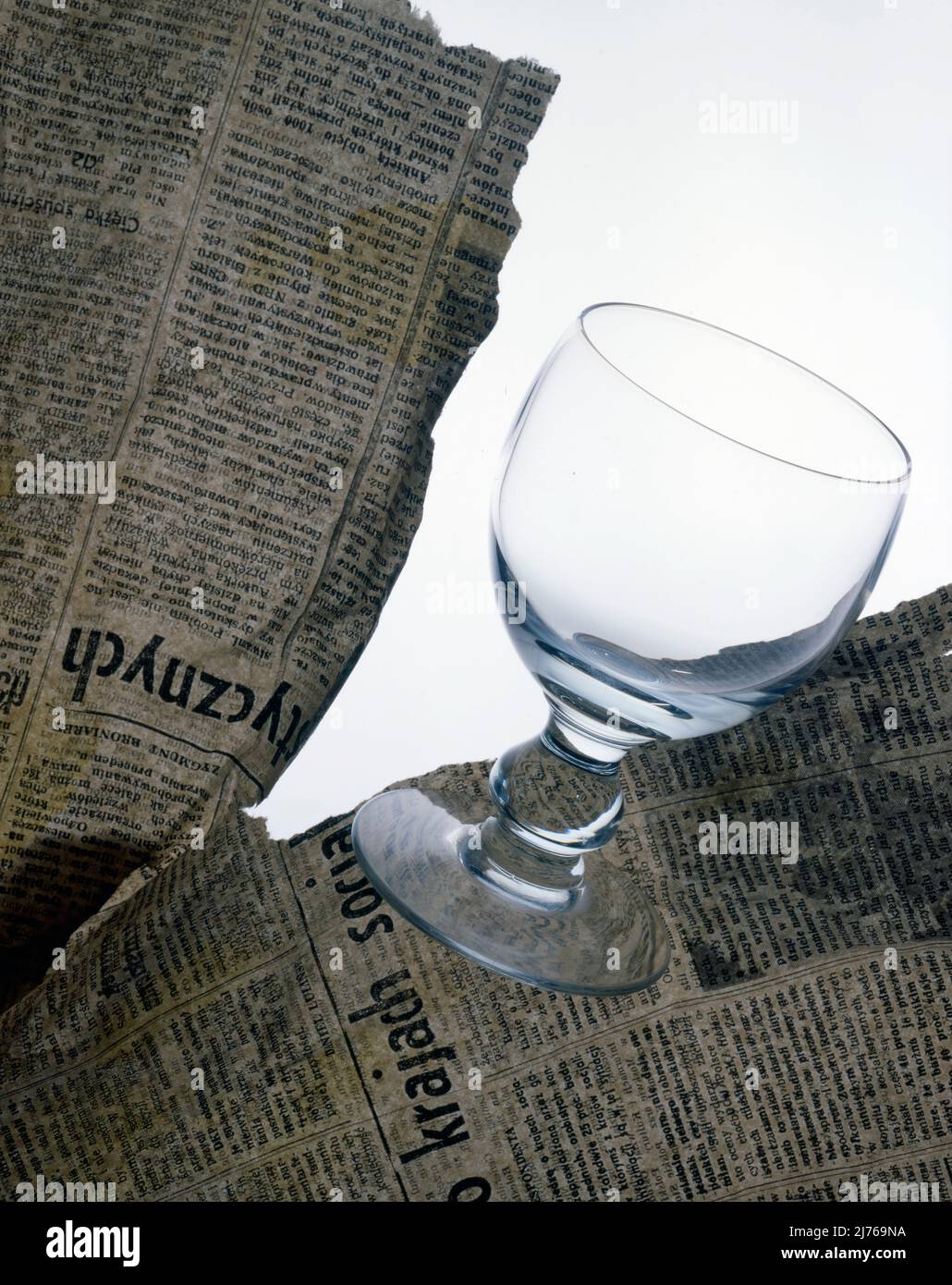 Wine glass, newspaper Stock Photo Alamy