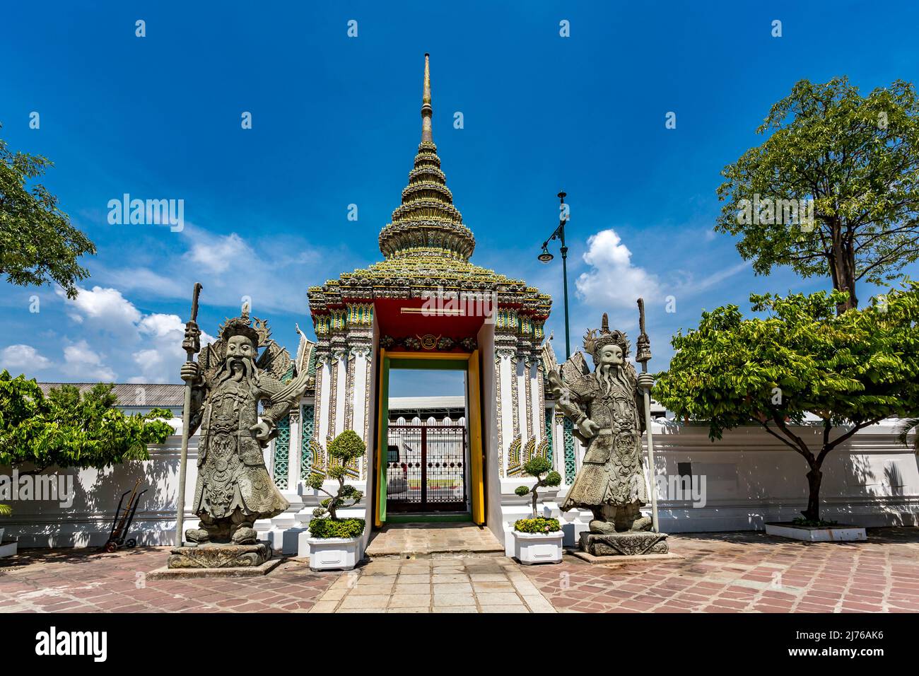Entrance gate protected by Chinese stone figures, temple guardians, temple complex Wat Pho, Temple of the Reclining Buddha, Bangkok, Thailand, Asia Stock Photo