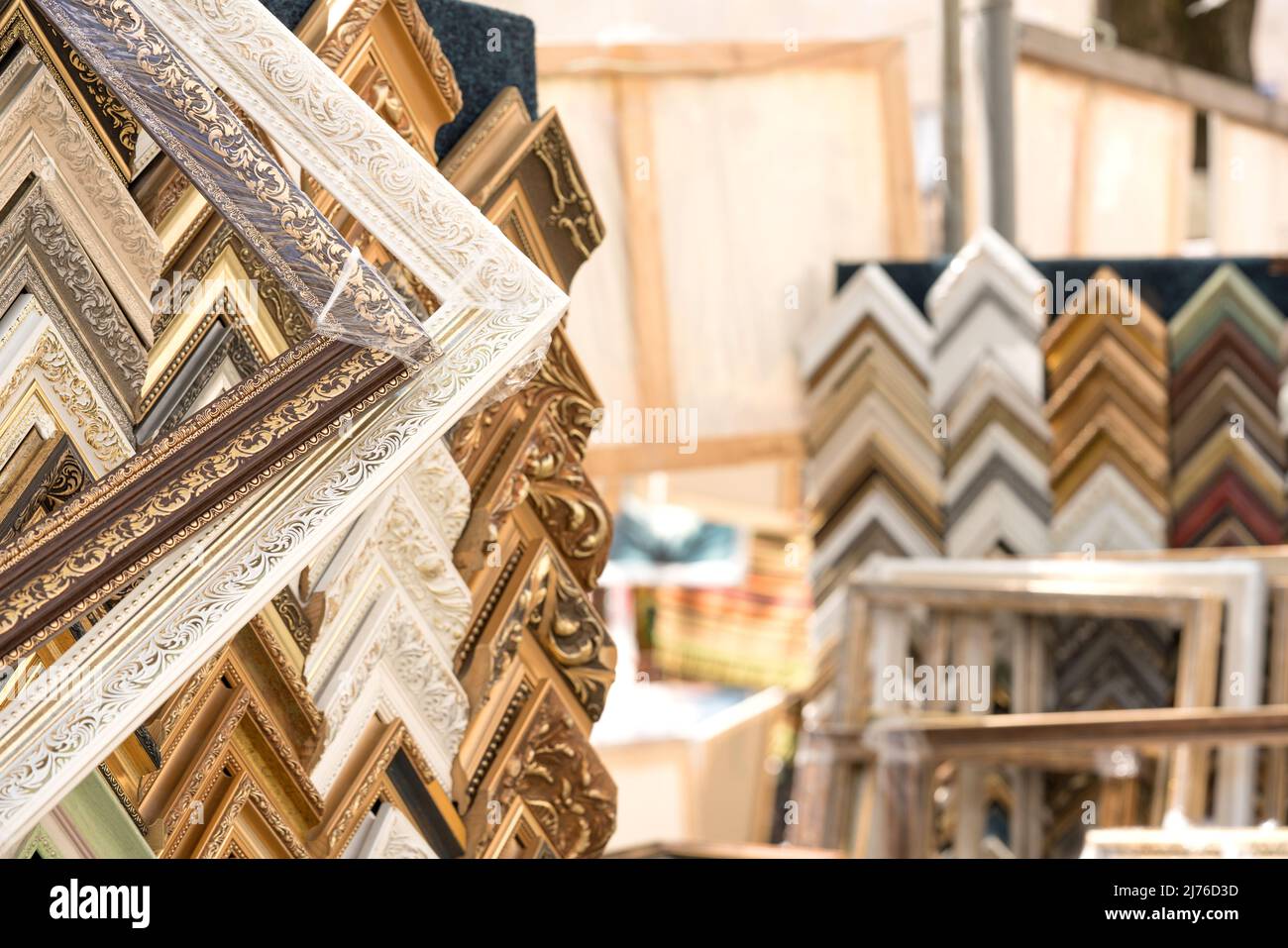 Variety of wooden and plastic picture frames in different colours and