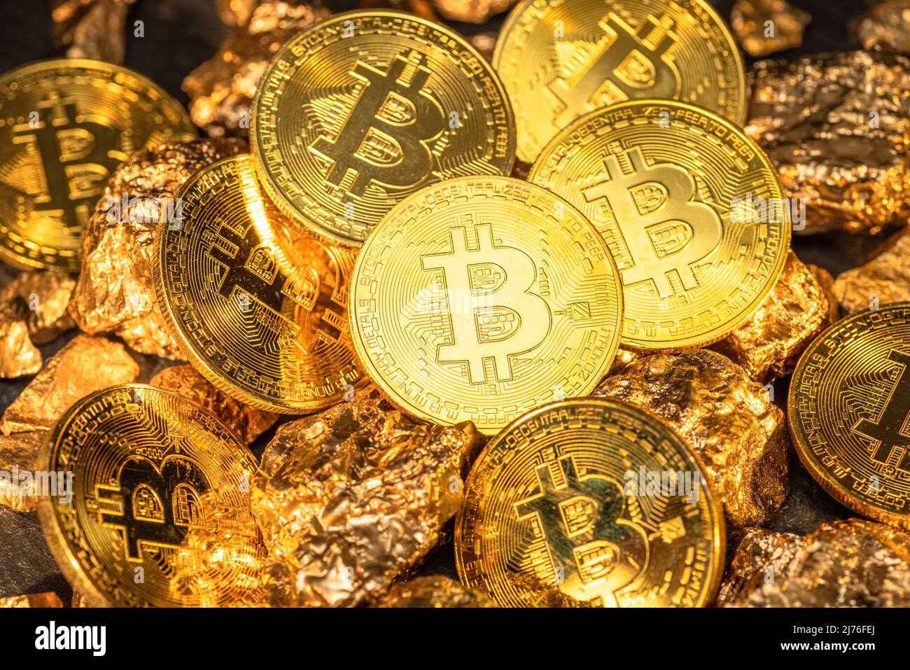 Bitcoins and pieces of gold closeup. Bitcoin against gold, what is the more  attractive asset Stock Photo - Alamy