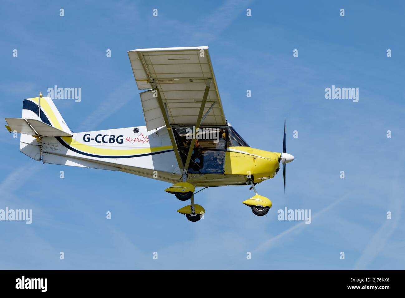 Skyranger Swift microlight aeroplane G-CCBG arrives over Popham airfield in Hampshire England to attend the annual microlight aircraft fly-in meeting Stock Photo