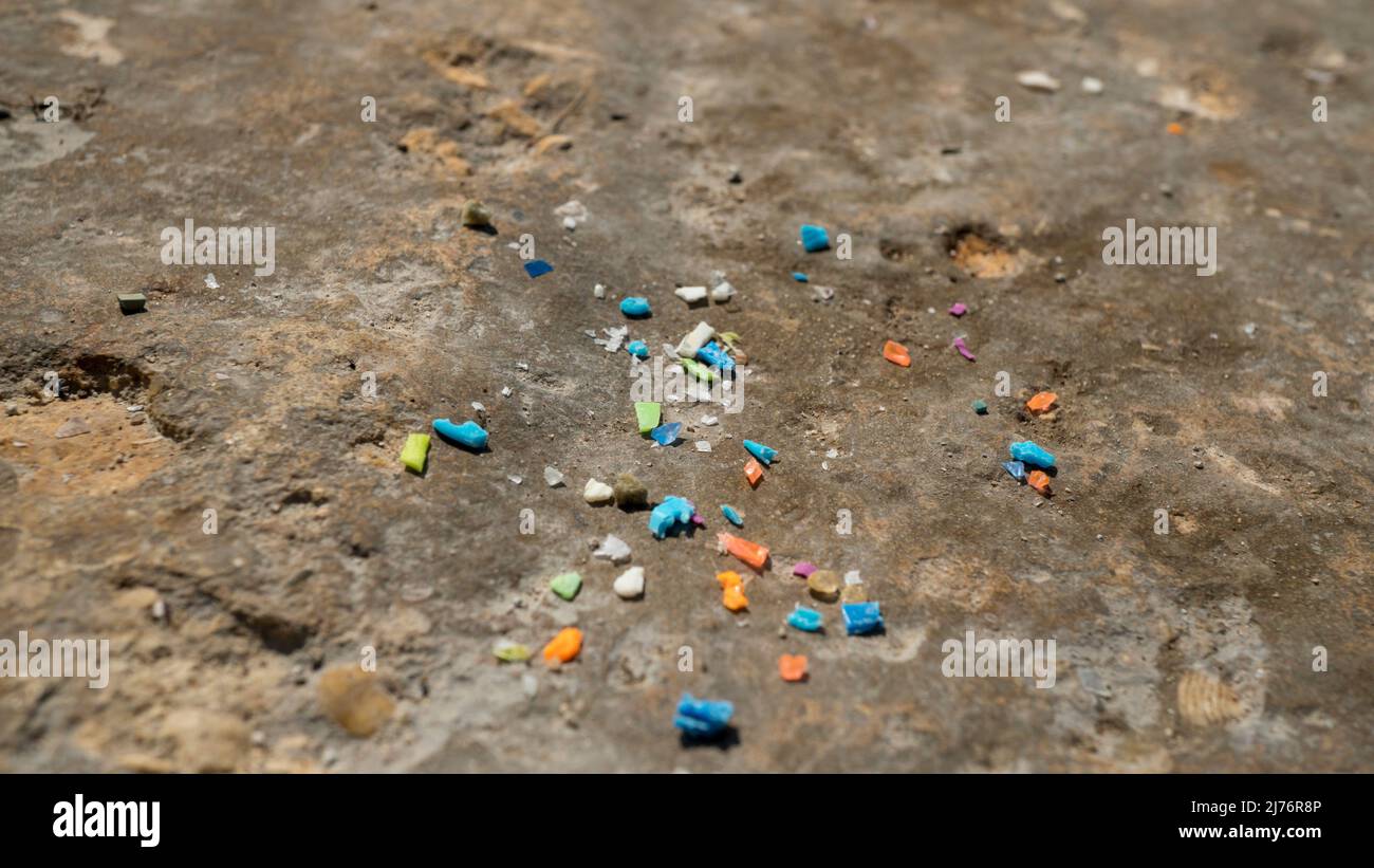 Macro shot of microplastic particles. Plastic pollution and water pollution concept. Stock Photo