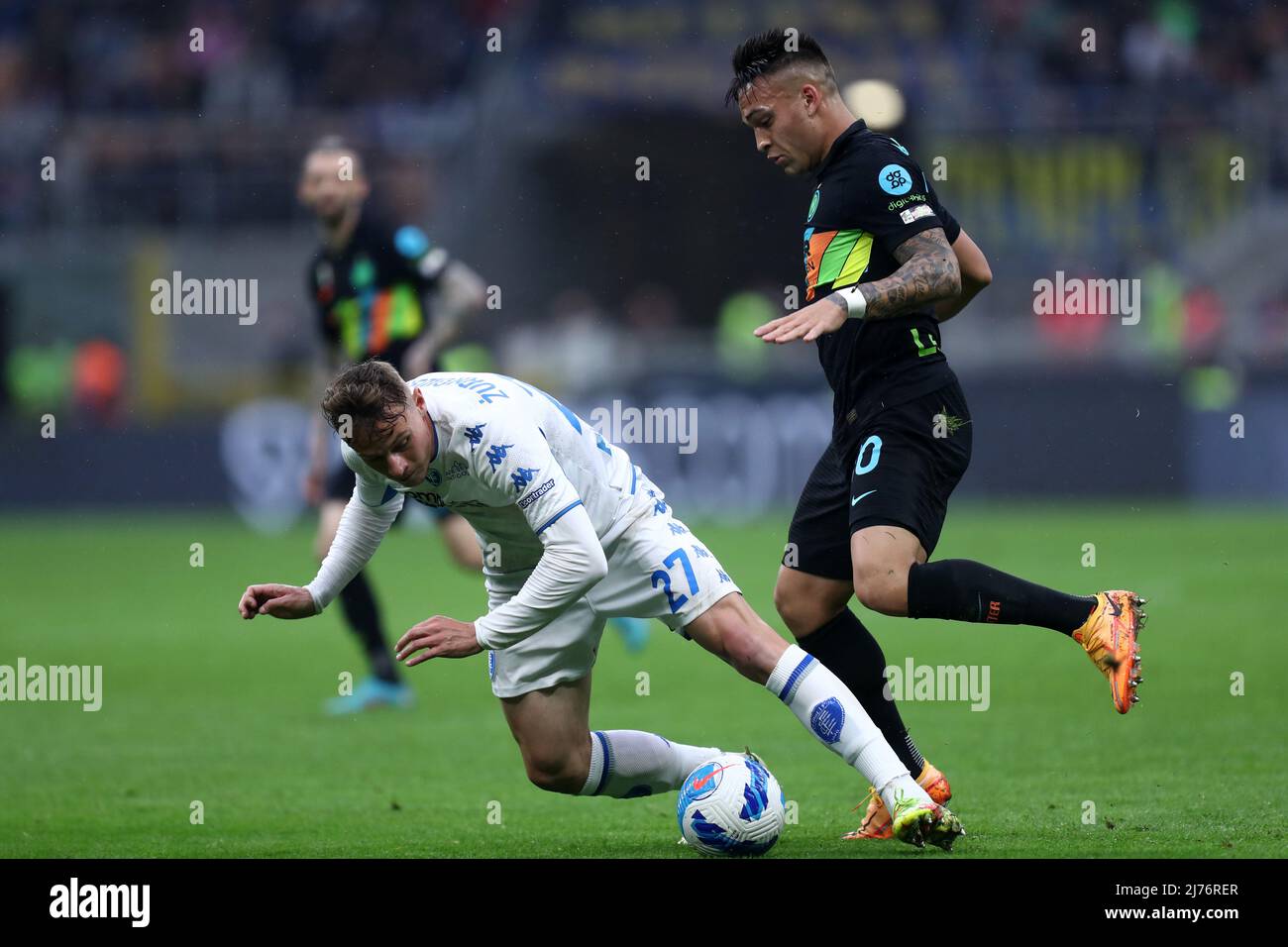 Szymon Zurkowski of Empoli Fc and Lautaro Martinez of Fc Internazionale battle for the ball during the Serie A match between Fc Internazionale and Empoli Fc at Stadio Giuseppe Meazza on May 6, 2022 in Milan, Italy. Stock Photo