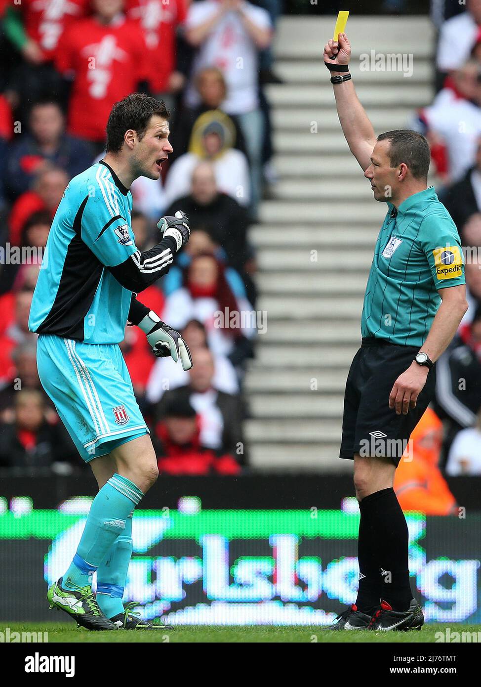 12 May 2013 - Soccer - Barclays Premier League - Stoke City Vs Tottenham Hotspur - Asmir Begovic of Stoke City recieves a yellow card from referee Kevin Friend after a disagreement over an injury -  Photographer: Paul Roberts / Pathos. Stock Photo