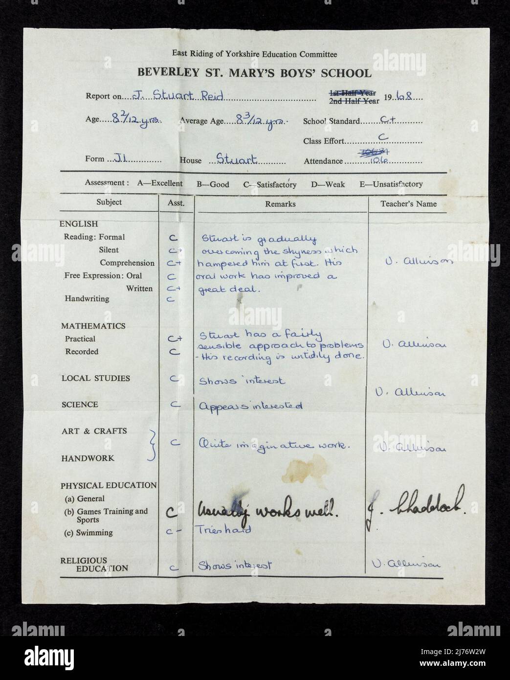 An average school report (mainly C grades!) from a primary school boy in  1968, part of a 1960's themed replica memorabilia. Stock Photo