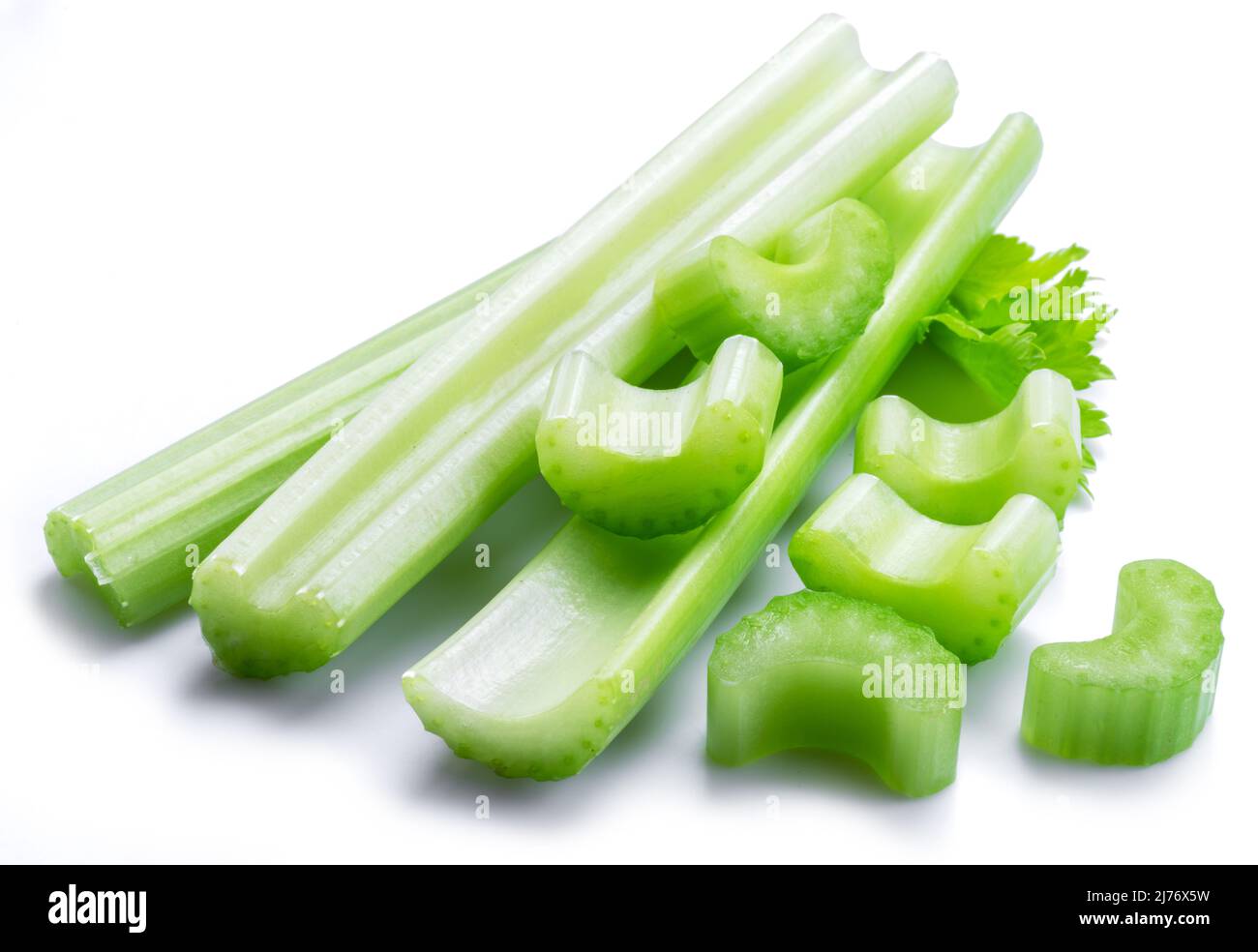 Pile of celery ribs and cuts isolated on white background Stock Photo