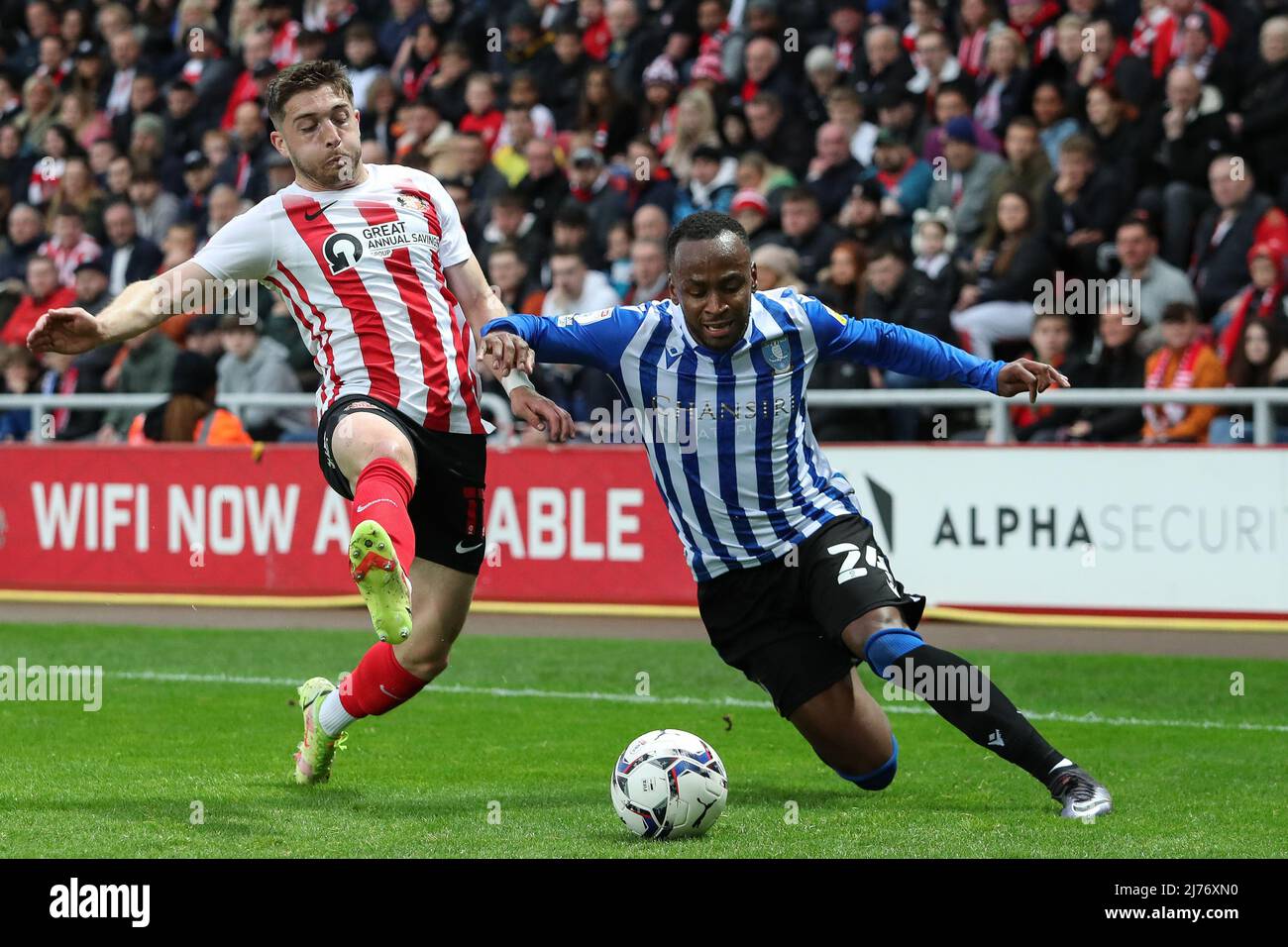 Saido Berahino #24 of Sheffield Wednesday is challenged by Lynden Gooch #11 of Sunderland  in Sunderland, United Kingdom on 5/6/2022. (Photo by James Heaton/News Images/Sipa USA) Stock Photo