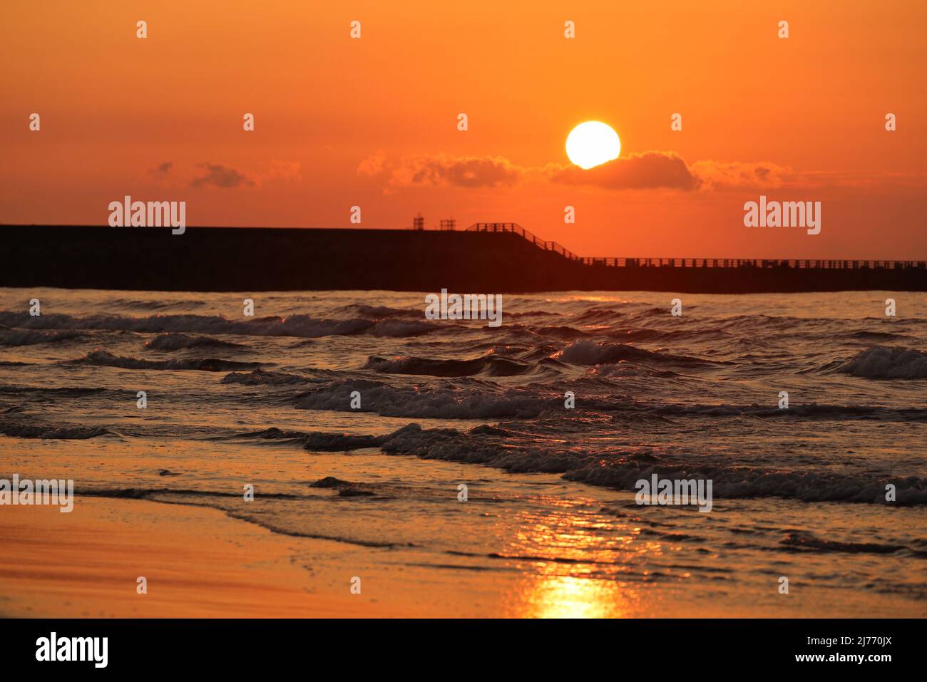 Sunset over the sea seen from the Uchinada coast in Ishikawa prefecture, Japan Stock Photo