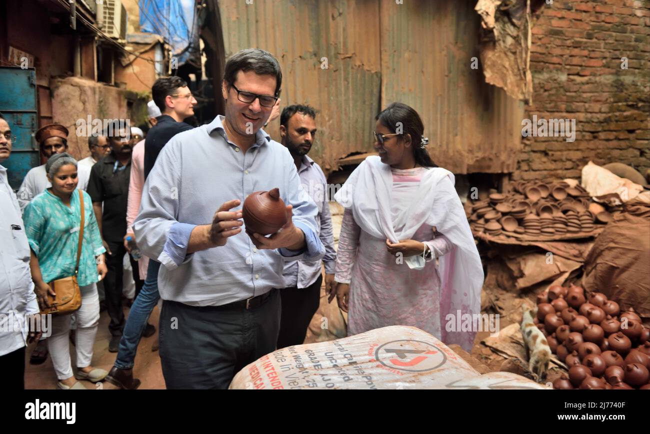 MUMBAI, INDIA - MAY 6: Australian Consulate General Peter Truswell with his team and Maharashtra Minister Varsha Gaikwad at a pottery during his visit to small and medium scale industries in the slums of Dharavi on  May 6, 2022  in Mumbai, India.  (Photo by Satish Bate/Hindustan Times/Sipa USA) Stock Photo