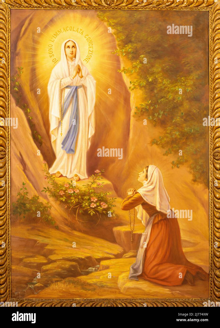 MONOPOLI, ITALY - MARCH 6, 2022:The painting of Appearance of Virgin Masry to st. Bernadette in Lourdes  in the church Chiesa di San Franceso d Assisi Stock Photo