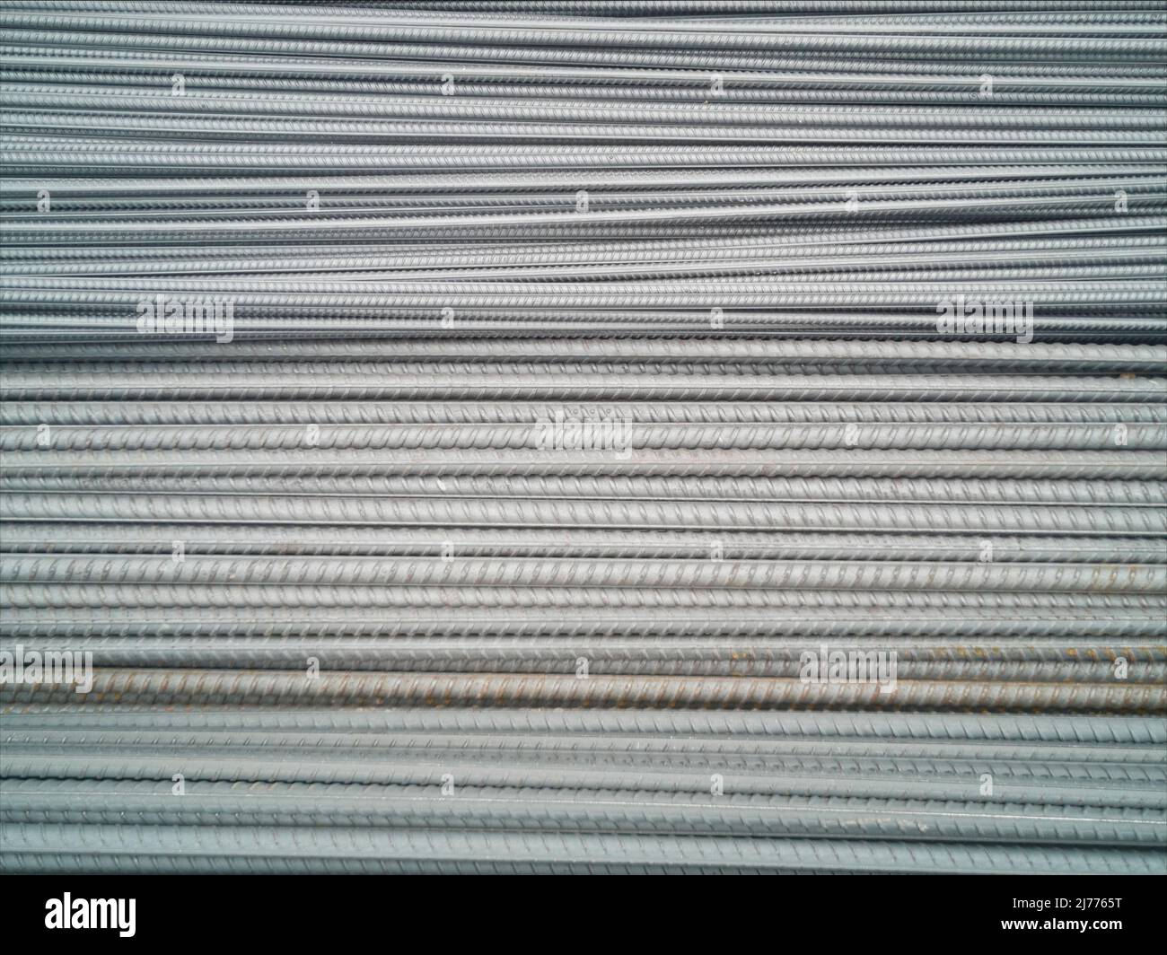 Closeup of concrete reinforcement steel rods in warehouse. Steel rods