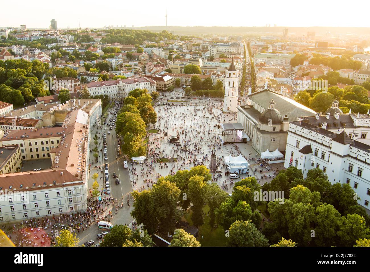 VILNIUS, LITHUANIA - JULY 6, 2021: Aerial view of crowds celebrating Lithuanian Statehood Day. Lots of people singing national anthem of Lithuania on Stock Photo
