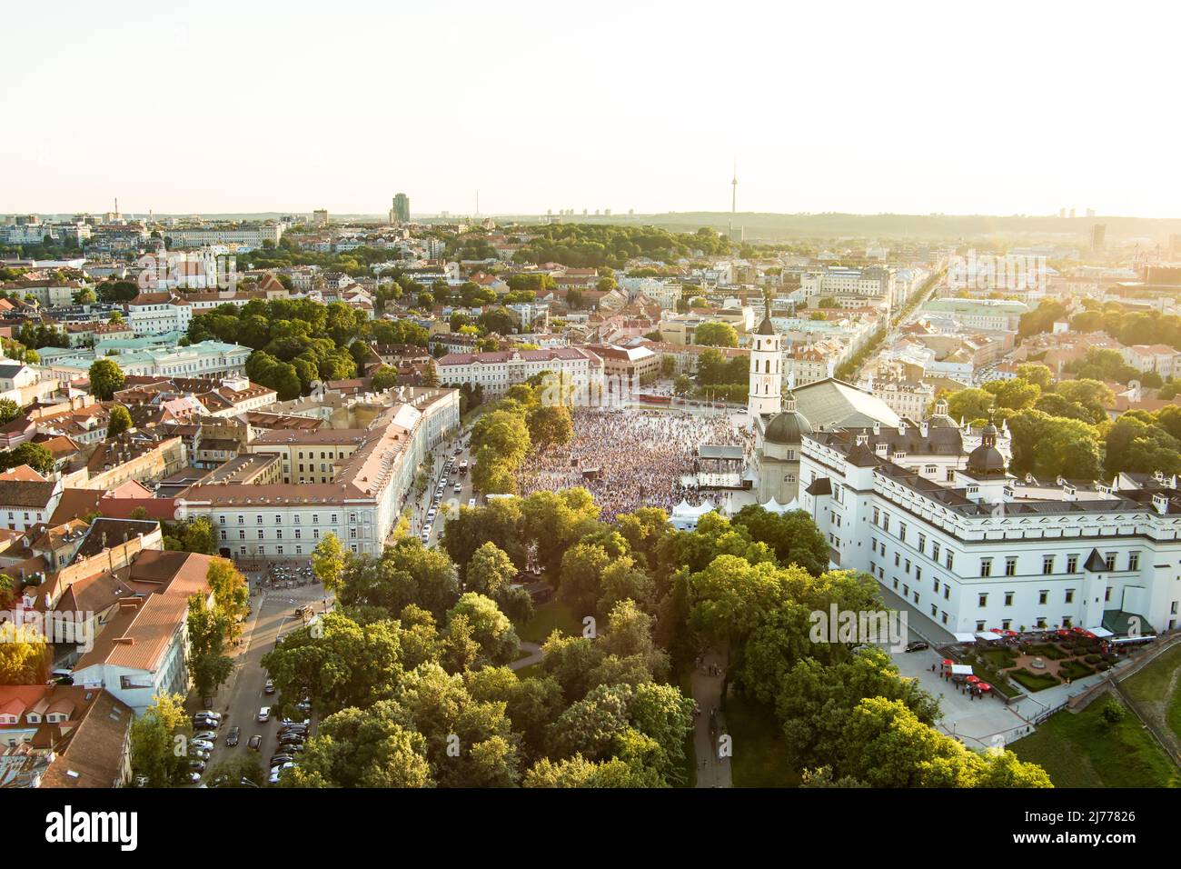 VILNIUS, LITHUANIA - JULY 6, 2021: Aerial view of crowds celebrating Lithuanian Statehood Day. Lots of people singing national anthem of Lithuania on Stock Photo