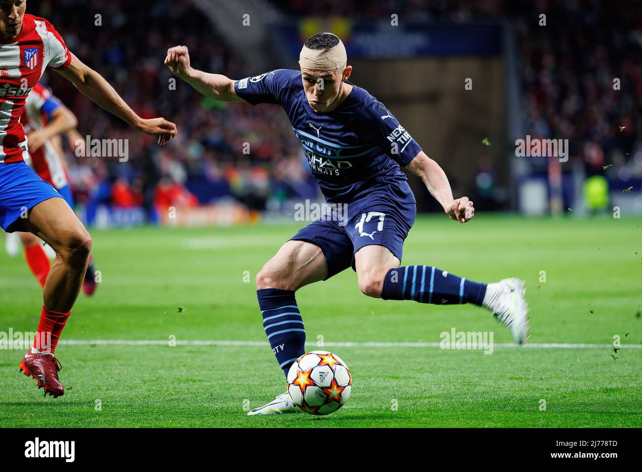 MADRID - APR 13: Phil Foden in action during the Champions League match between Club Atletico de Madrid and Manchester City at the Metropolitano Stadi Stock Photo