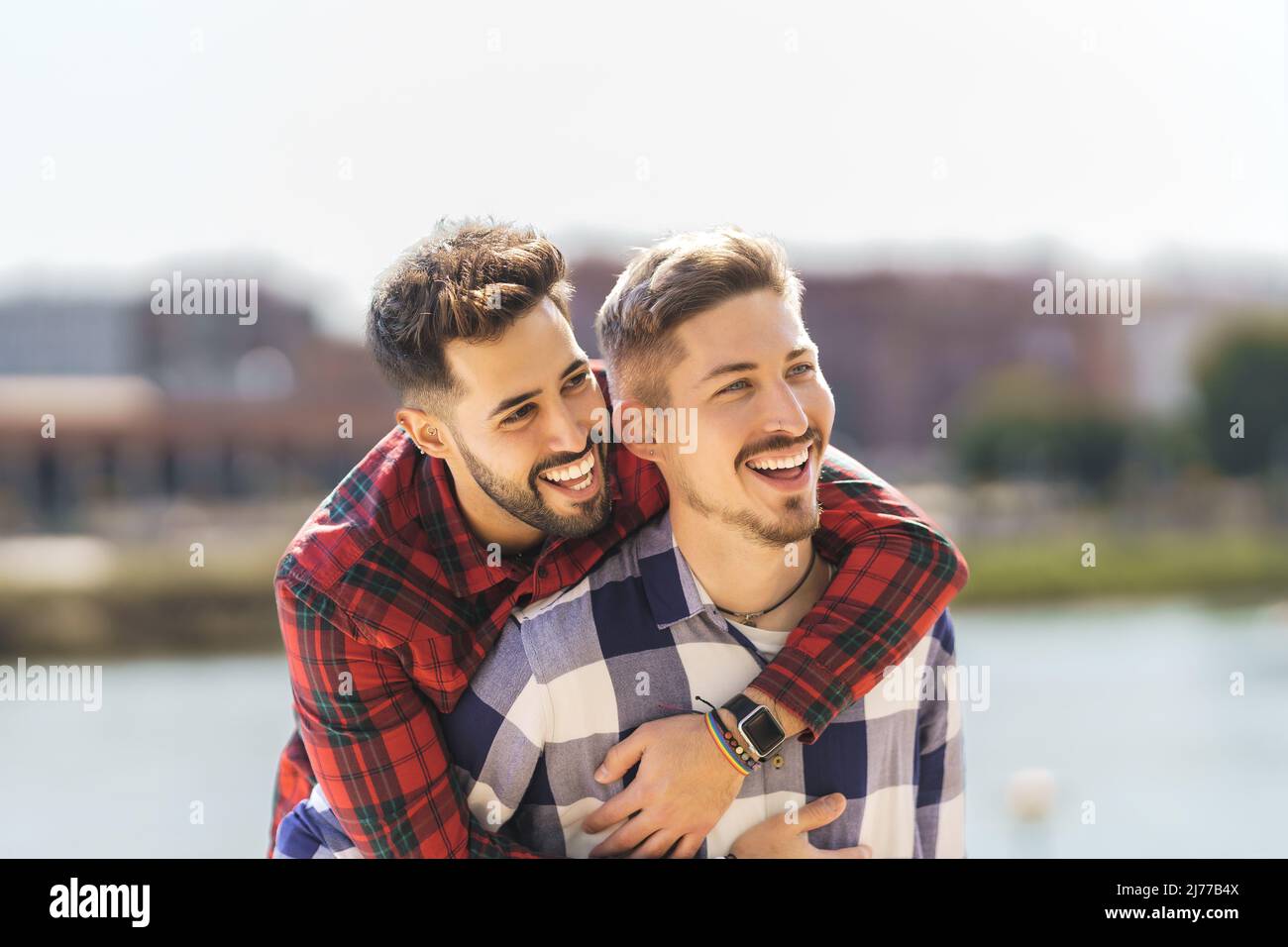 gay couple hugging and laughing Stock Photo Alamy