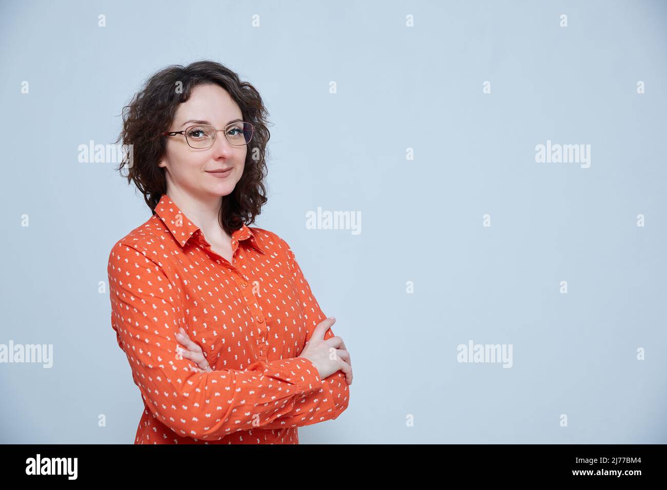 A brunette woman  on a background with a copy space Stock Photo