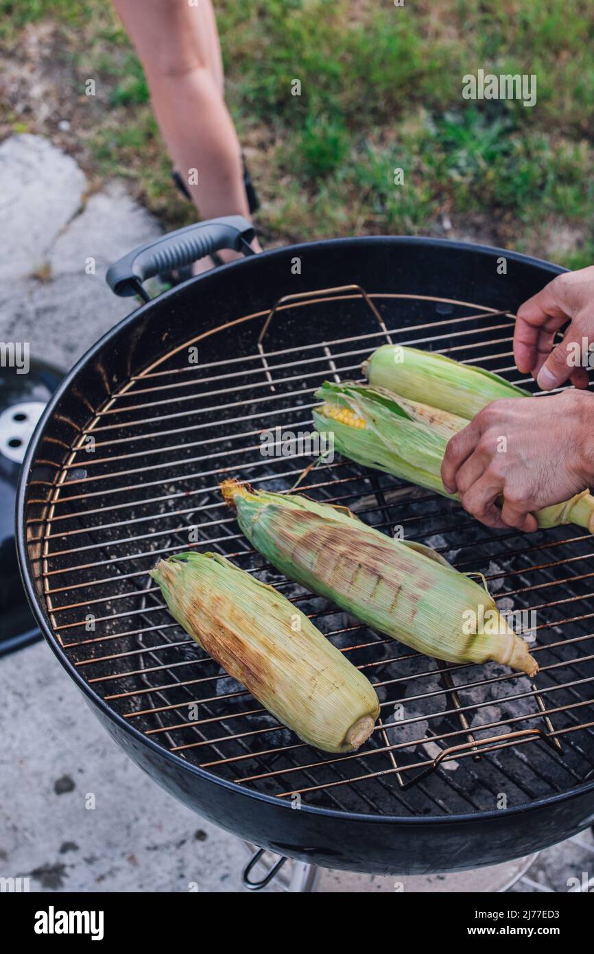 grilling corn on the barbecue Stock Photo