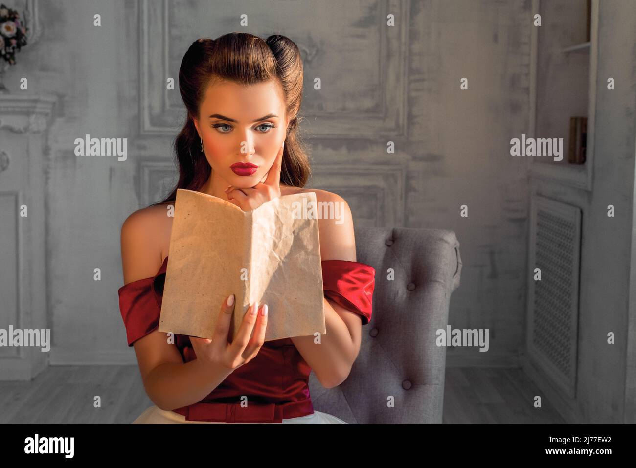 jailbait models Beautiful flirtatious girl as a pin up model reading a book in dress in  retro interior. Jailbait concept Stock Photo - Alamy