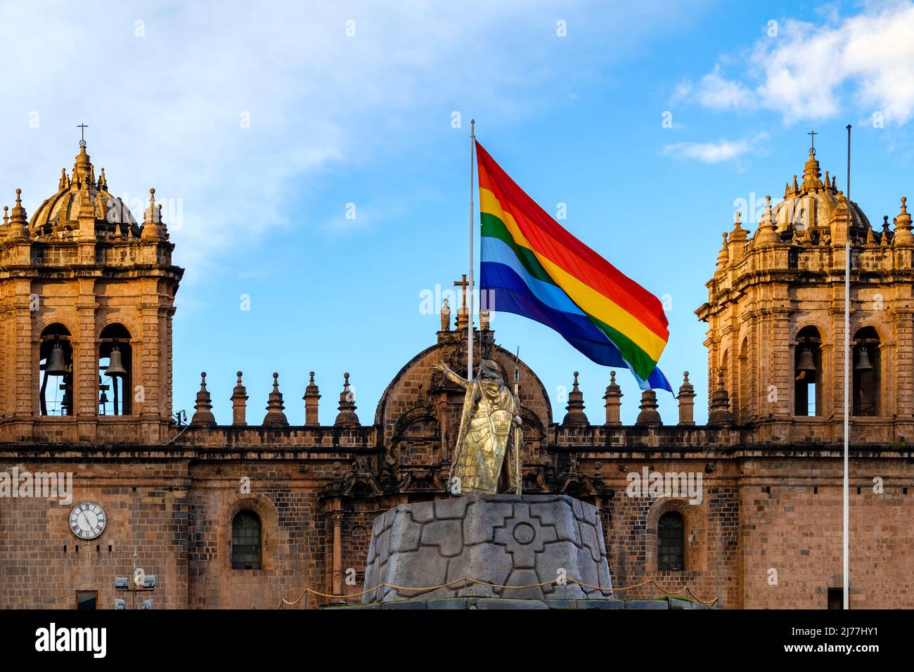 Cusco Cathedral, Basilica Cathedral of our Lady of Assumption, facade with Pachacutec statue and Cusco flag, Cuzco Plaza de Armas, Peru Stock Photo