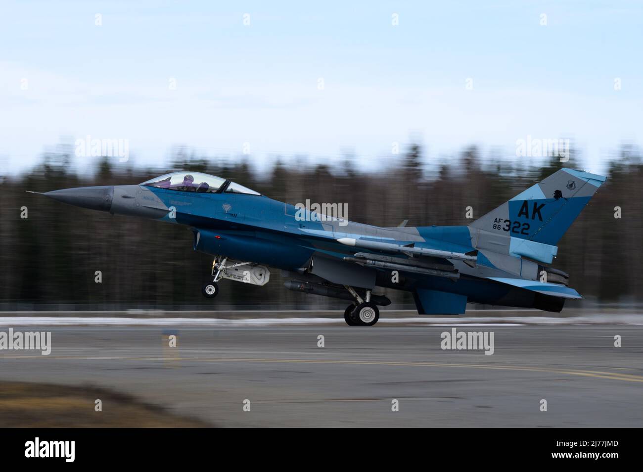A U.S. Air Force F-16 Fighting Falcon assigned to the 18th Aggressor Squadron takes off from Eielson Air Force Base, Alaska, during RED FLAG-Alaska 22-1, May 2, 2022. The 18th AGRS supports RF-A 22-1 by sharing its knowledge of adversarial tactics, techniques and procedures to participating units, ensuring the United States and its allies receive the best air combat training possible. (U.S. Air Force photo by Senior Airman Jose Miguel T. Tamondong) Stock Photo