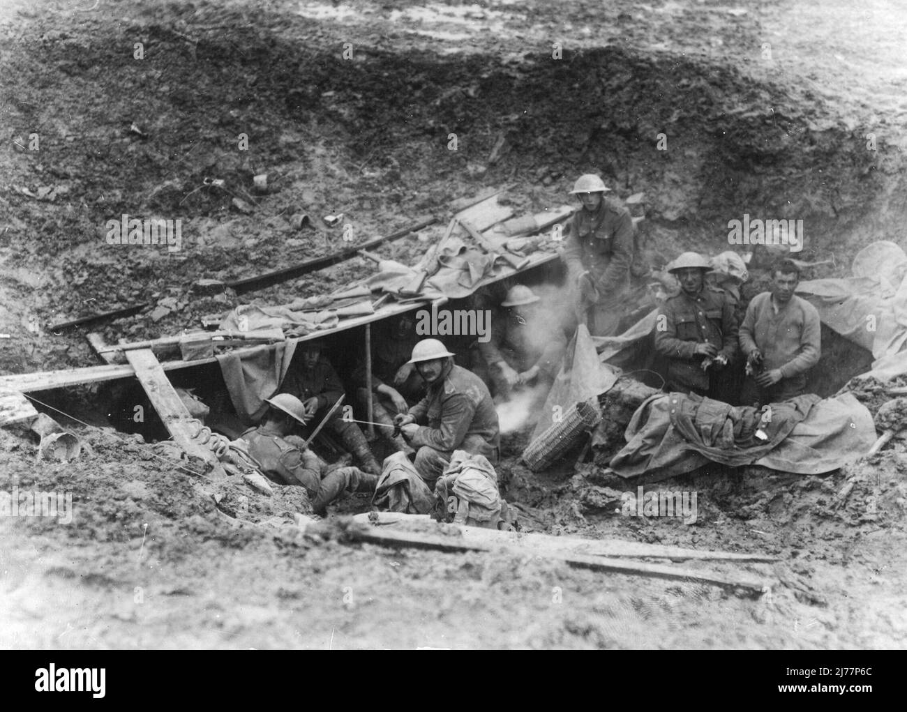 Soldiers resting in a shell hole 5 kilometres beyond the old German front line Stock Photo