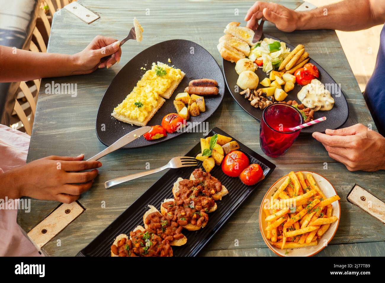 Group of friends having breakfast in the restaurant Stock Photo Alamy