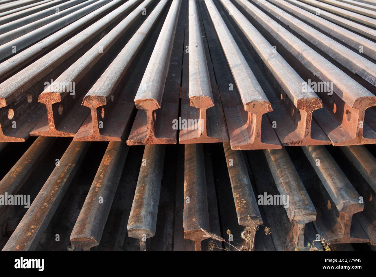 Stack of railway rail Stock Photo Alamy