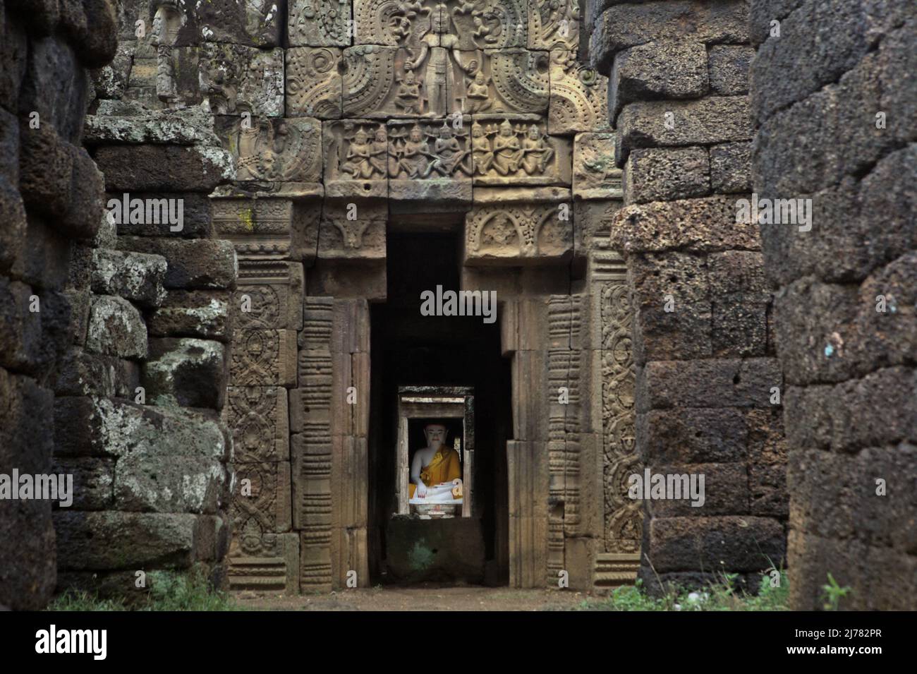 A Buddha statue that placed inside a chamber at Banteay Prei Nokor, an ancient temple in Kampong Cham, Cambodia. Stock Photo