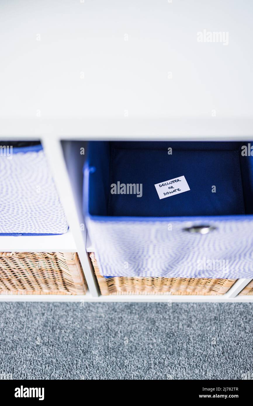 Unfocused Labels storage cube with Declutter of Dornate label inside of it with ...